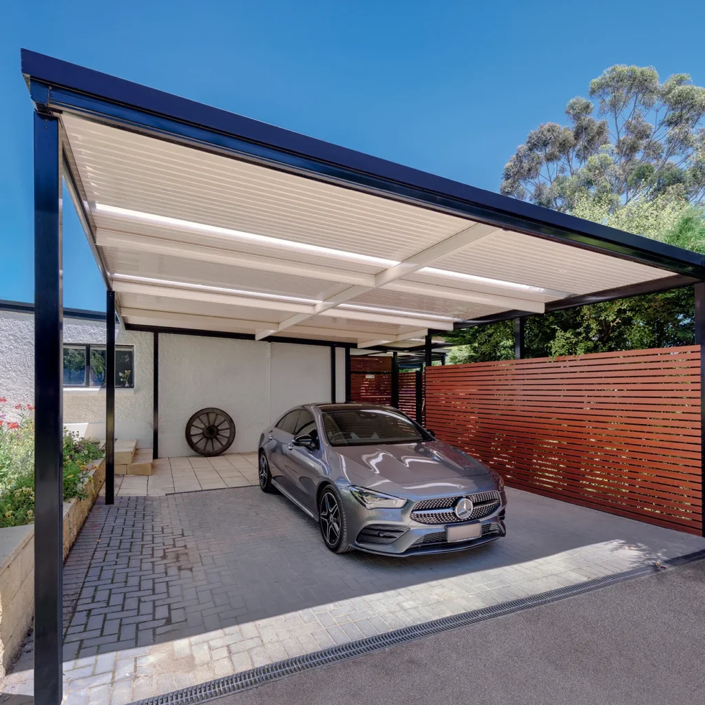 Shade cover installed over a driveway for everyday vehicle protection.