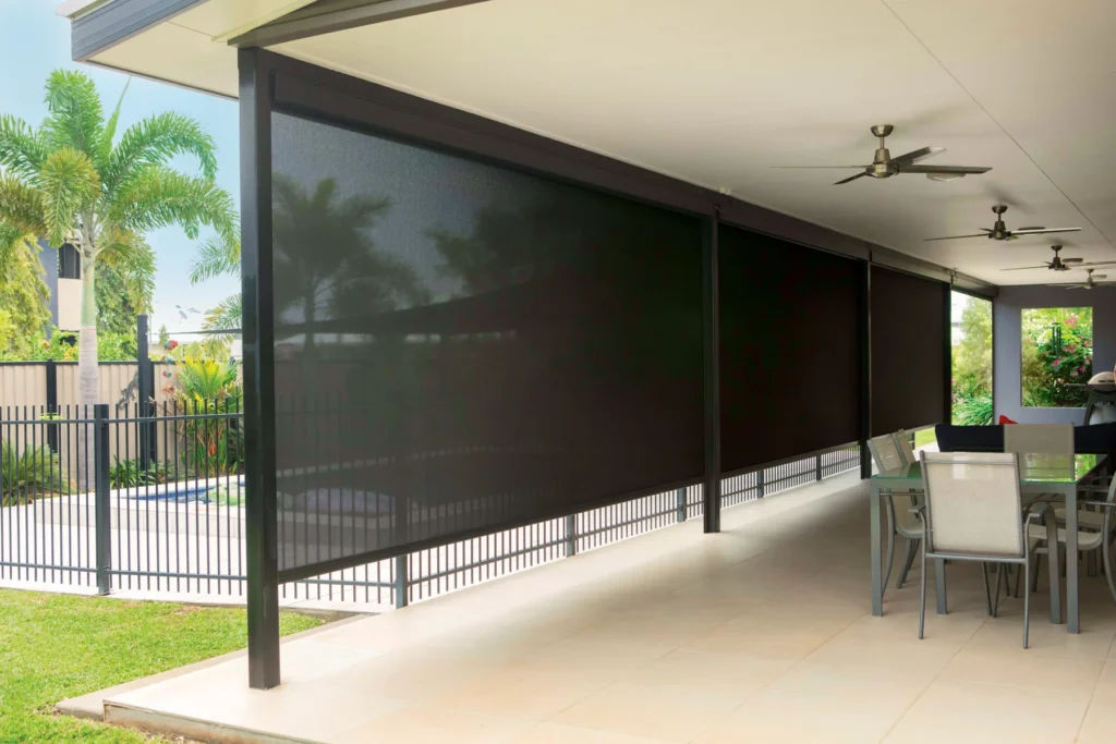 Residential outdoor area improved with modern outdoor blinds.